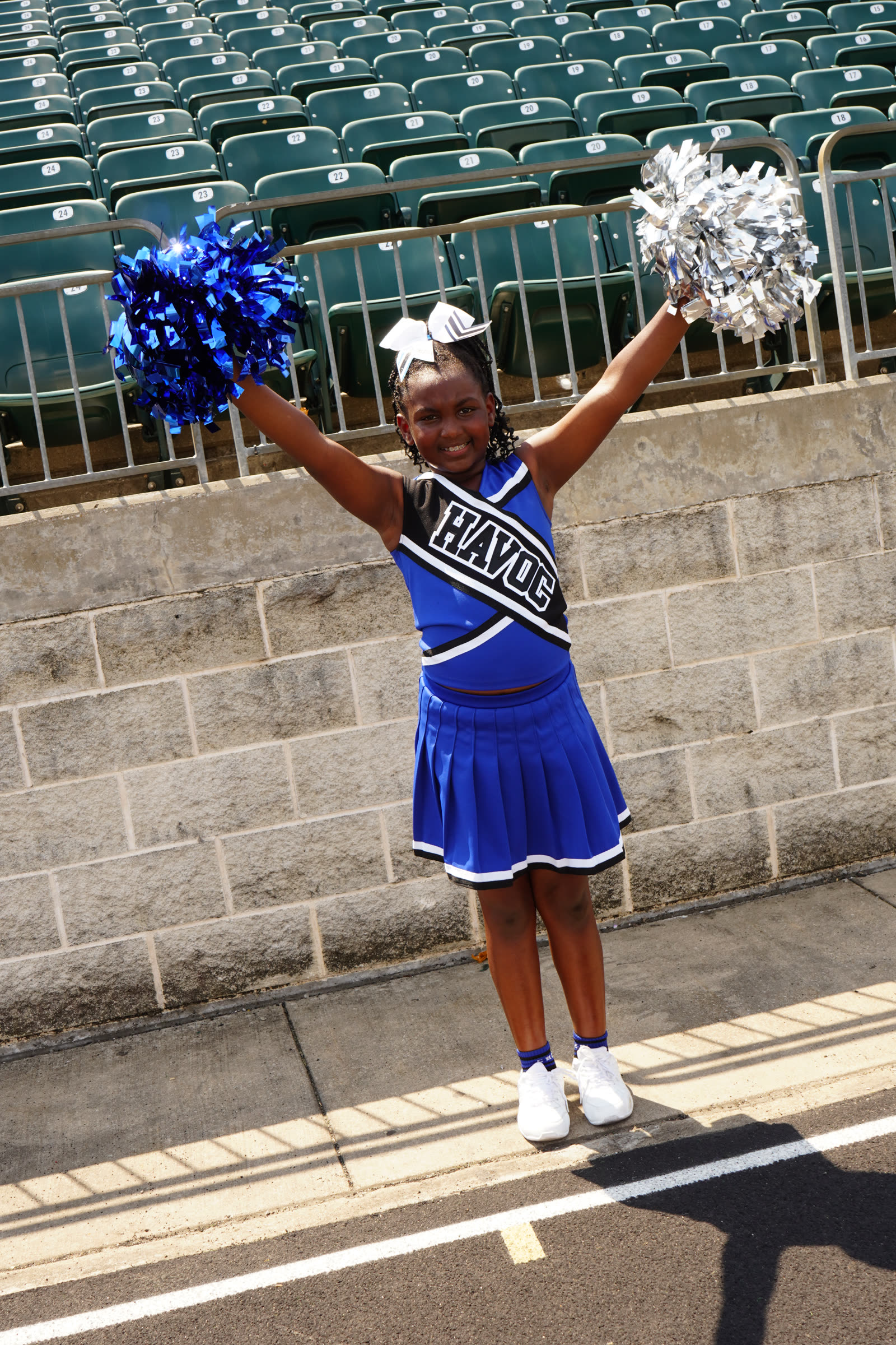 Draya West cheering with pom poms